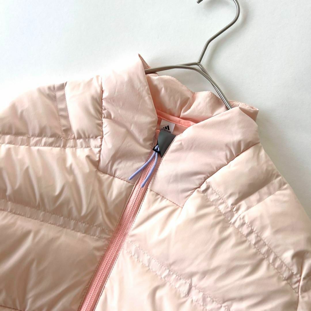 adidas(アディダス)の新品タグ付 adidas ダウンジャケット ピンク Lサイズ 30800円 レディースのジャケット/アウター(ダウンジャケット)の商品写真